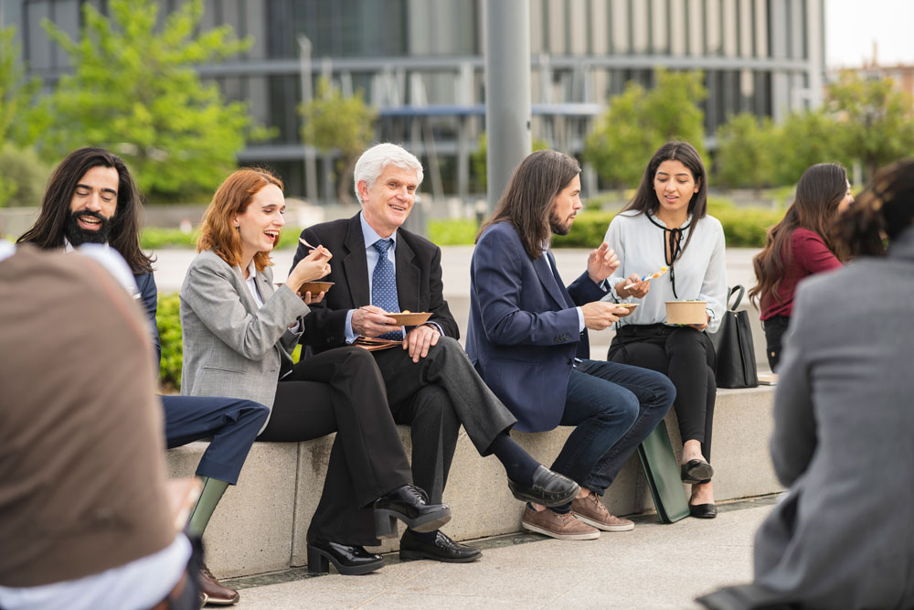 How to avoid the summer slump group of employees taking lunch outside