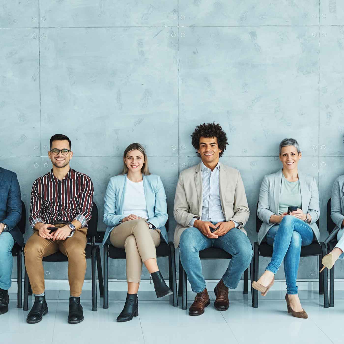 Happy employees in a waiting room