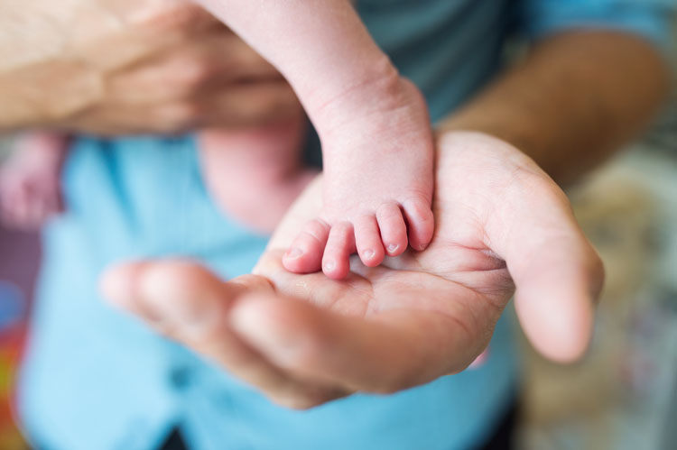 Fathers Hand and Babies Foot