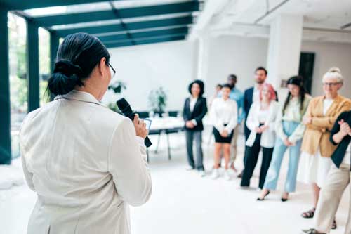 manager speaking to group of employees