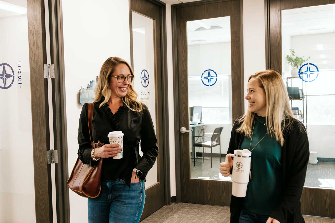 Happy Lakeside HR Group Employees Walking in Office