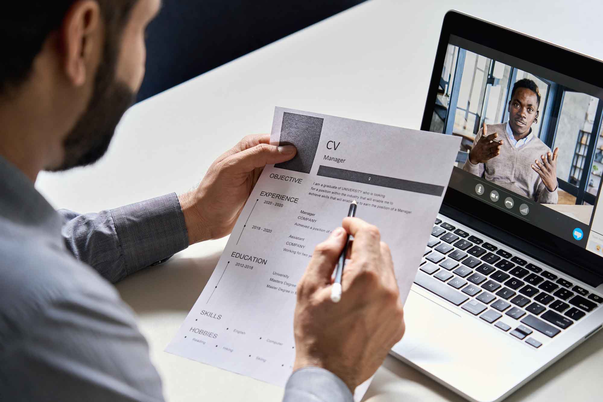 JobInterviewRecruitingFirm Resume and interviewer on computer remote